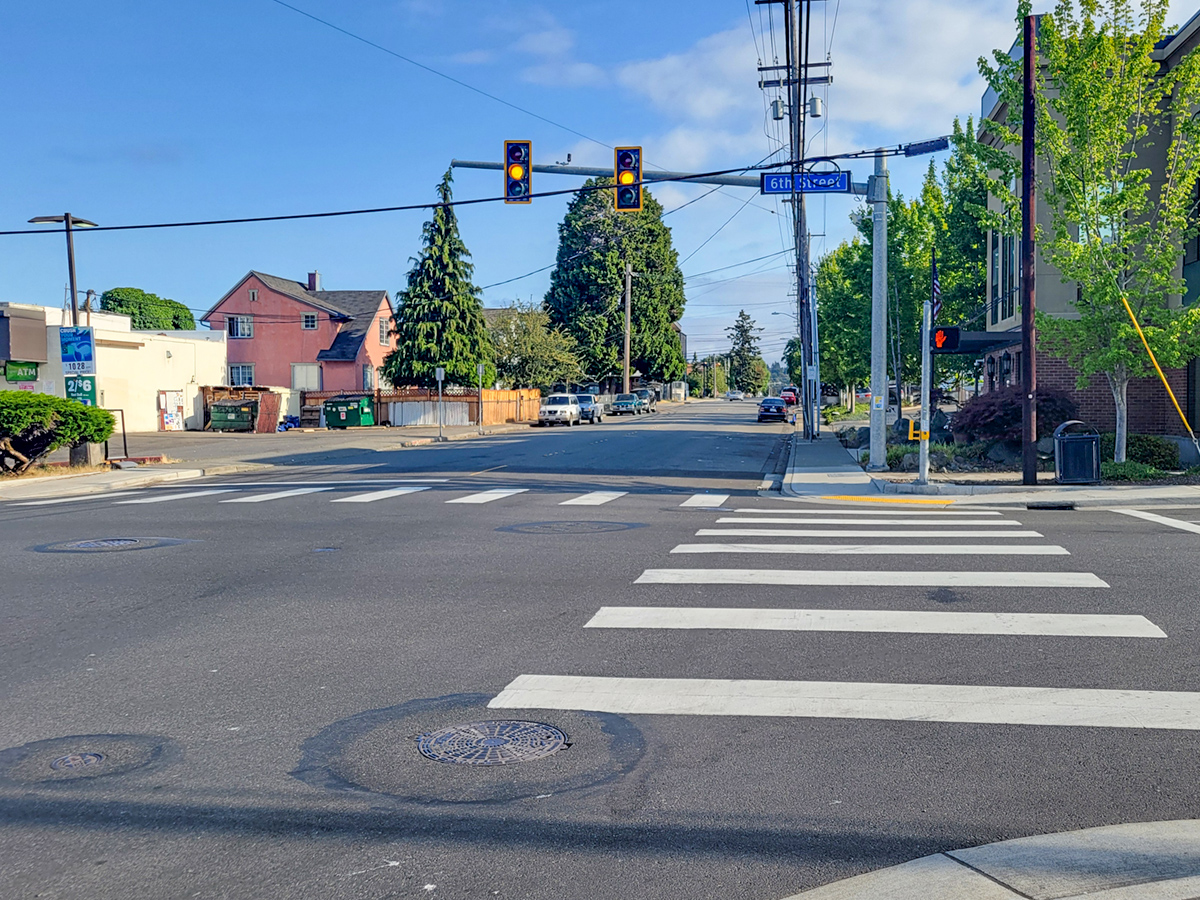 Image of an intersection along the 6th Street corridor with pedestrian crossings.