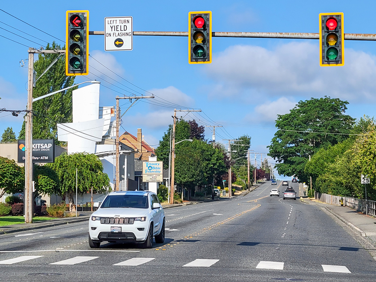 Image of 6th Street roadway with sidewalks on each side. This perspective provides a good representation of the width of the road.